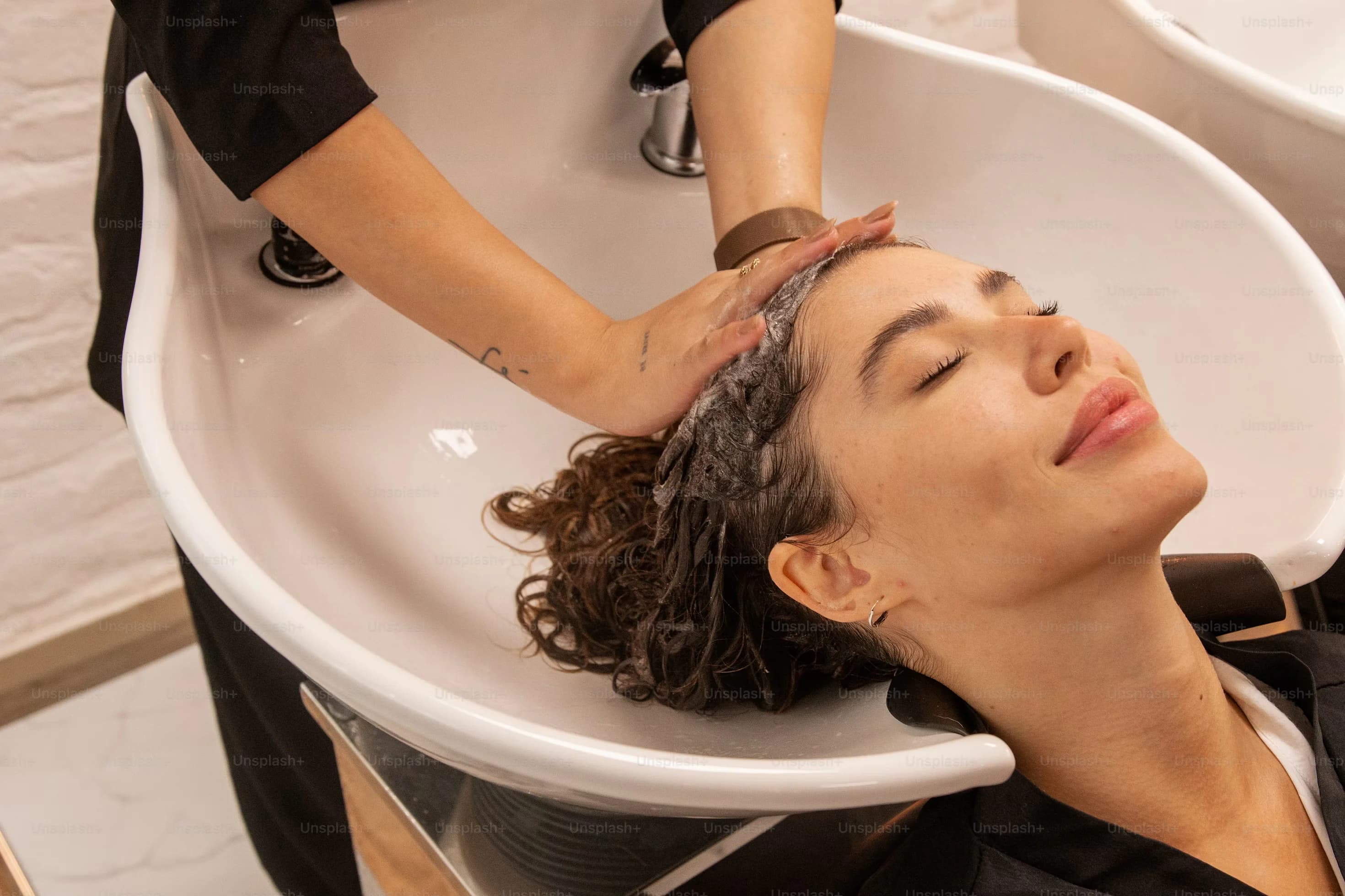 A client enjoying a calming hair and scalp ritual