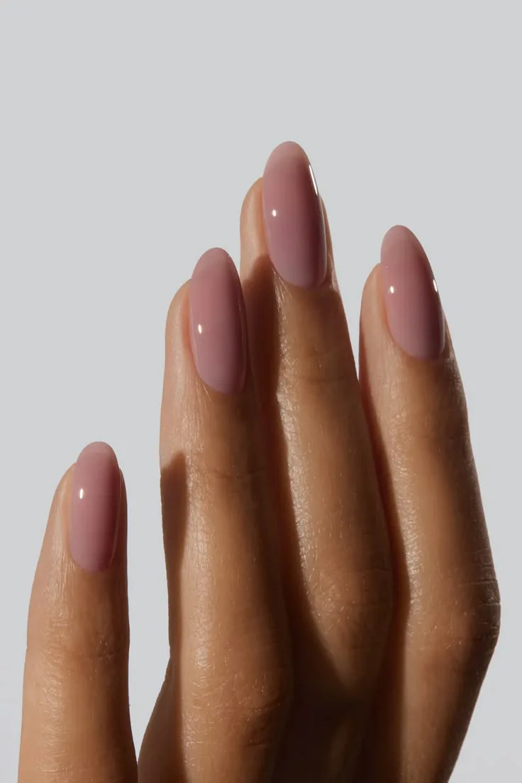 Fresh nude manicure on neatly groomed nails